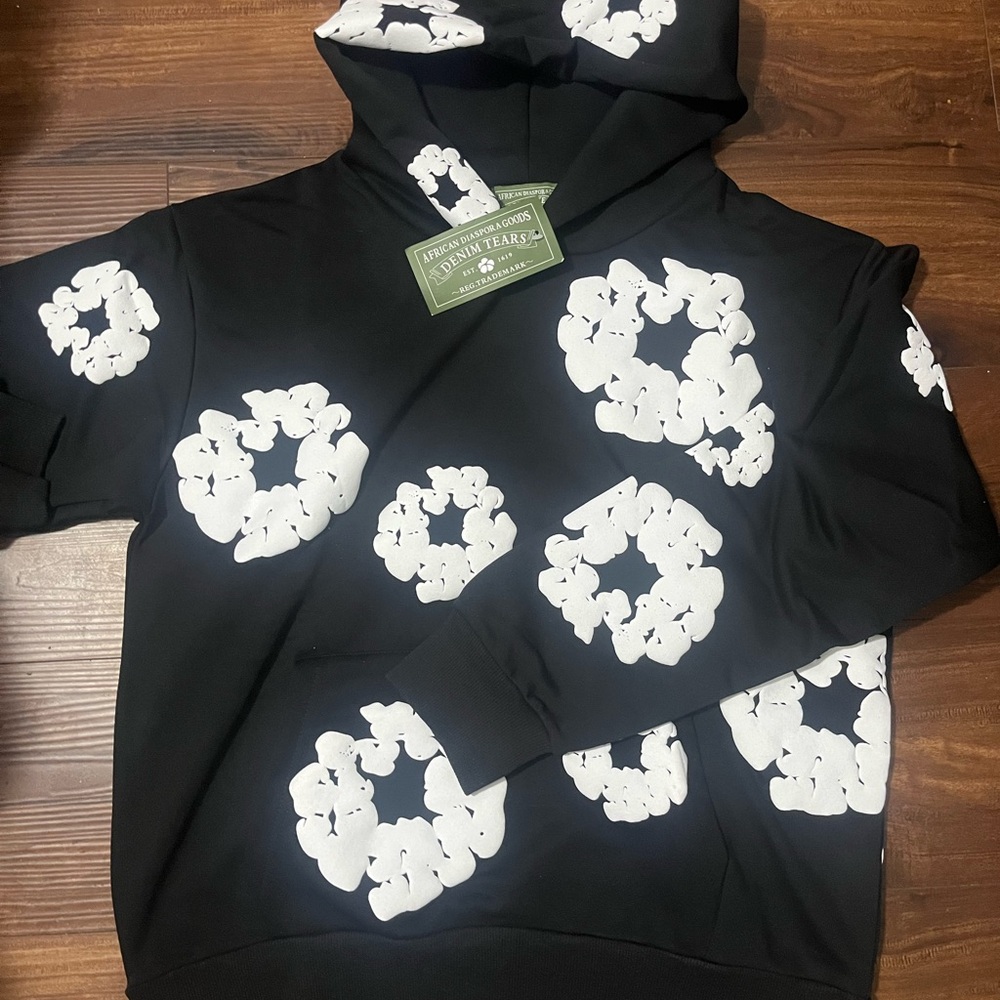 White on black denim tears hoodie. Size small, hmu for interest
